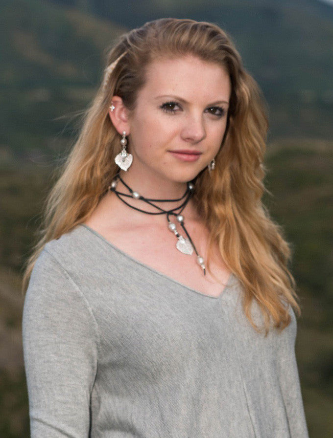 Lariat: Eight pearls highlight this versatile necklace, Peacock freshwater pearls, silver Aspen leaf, black deerskin leather.