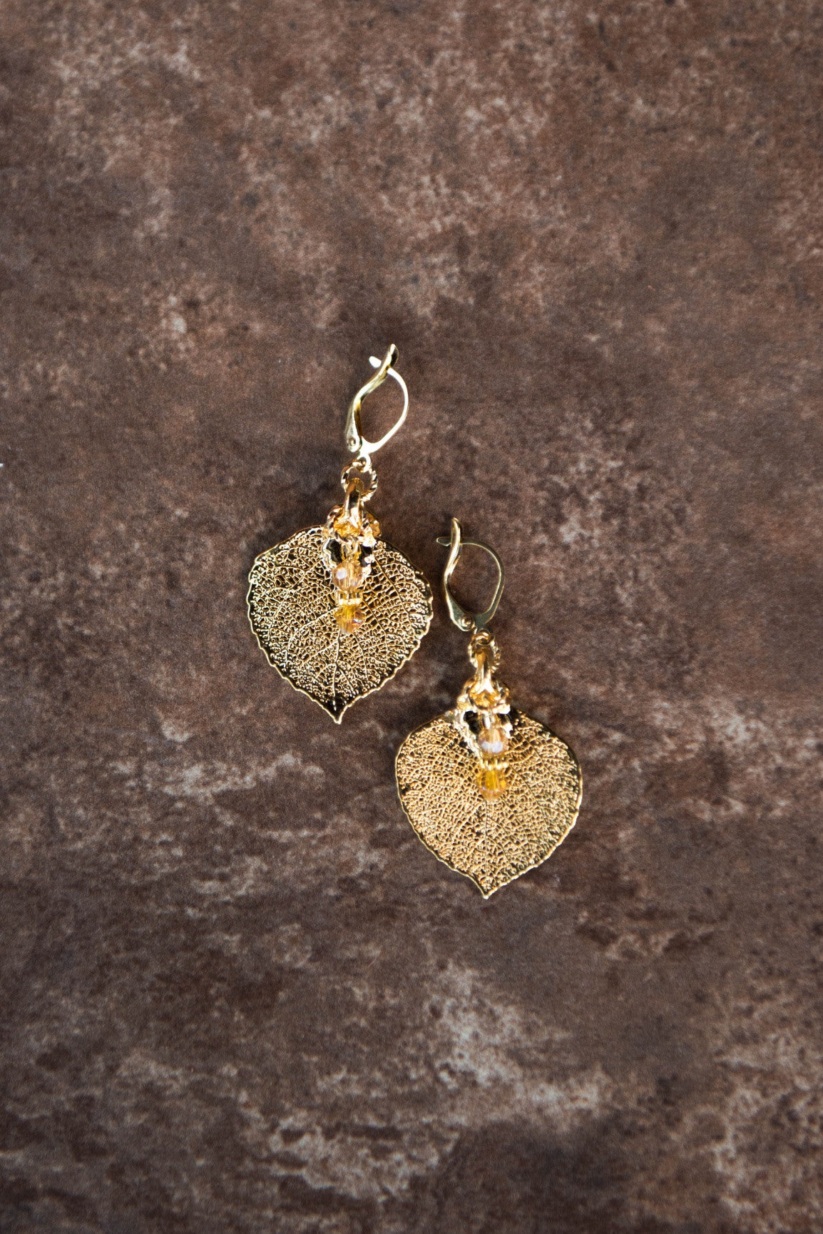 Gold earrings: Our classic gold leaf earrings with crystal dangles complete with hinge hardware.