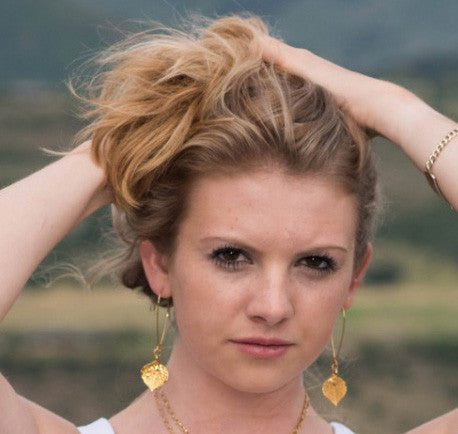 Gold earrings: Gold leaves come together with teardrop light weight gold long hoops. Finished with crystal dangles