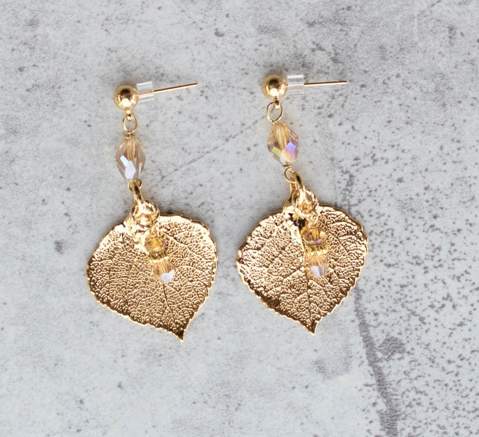 Gold earrings: Elegant gold leaf, long post earrings with crystal dangles.
