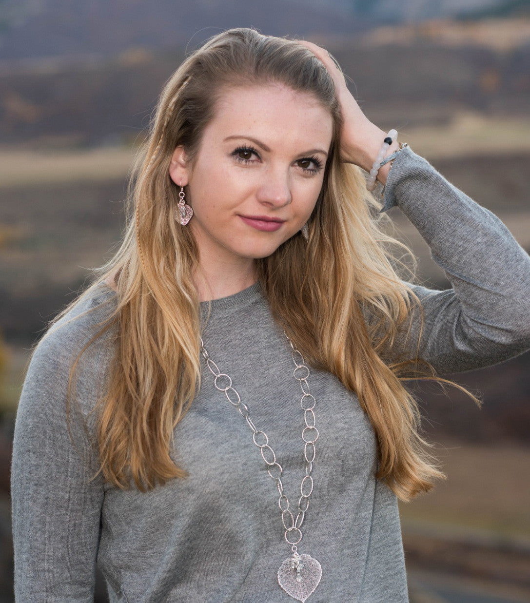 Classic silver faceted chain creates a modern long necklace with a Silver leaf and crystal dangles