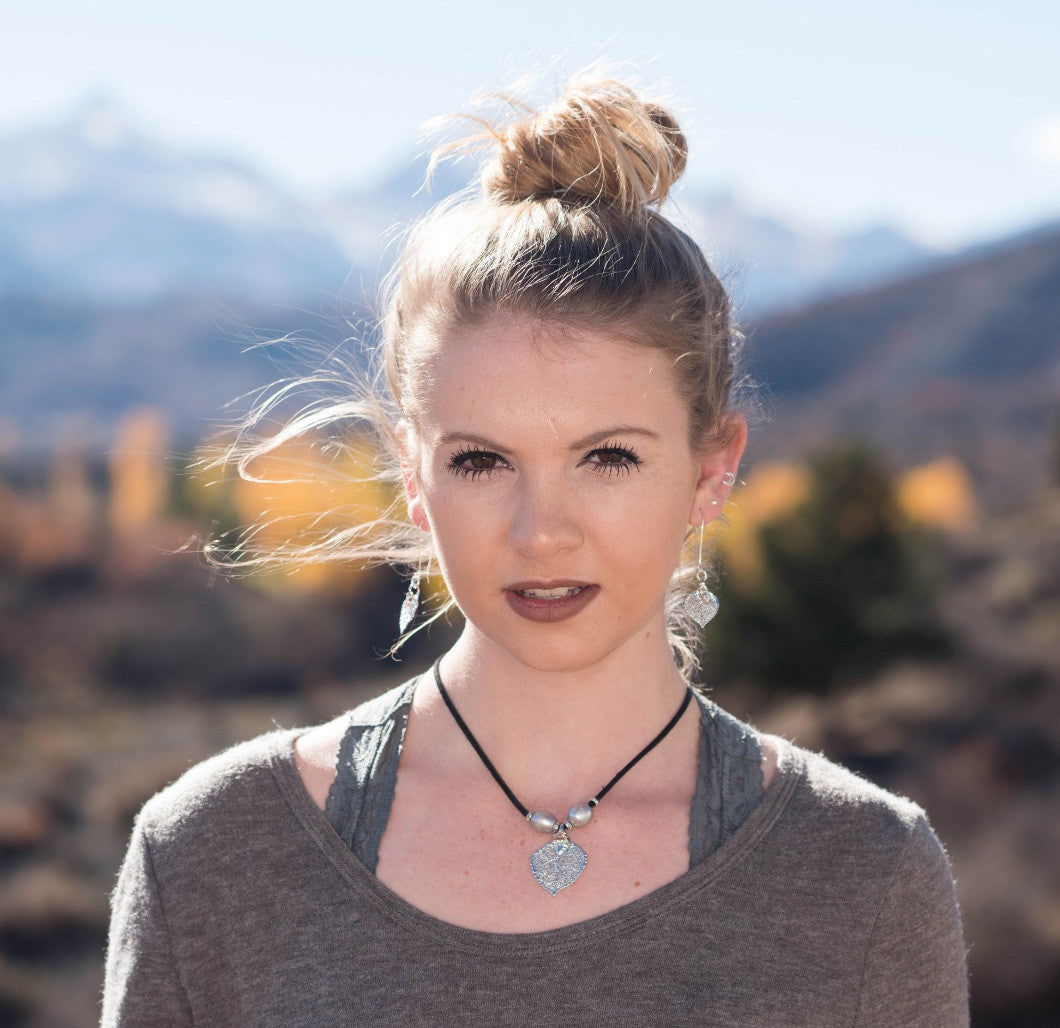 Three pearls choker: White pearls with a silver leaf, come together with black leather for this trendy versatile necklace