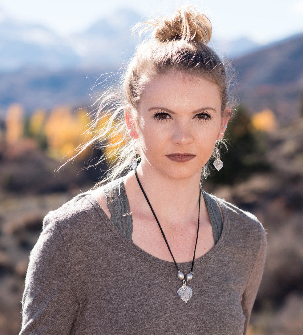 Three pearls choker: White pearls with a silver leaf, come together with black leather for this trendy versatile necklace