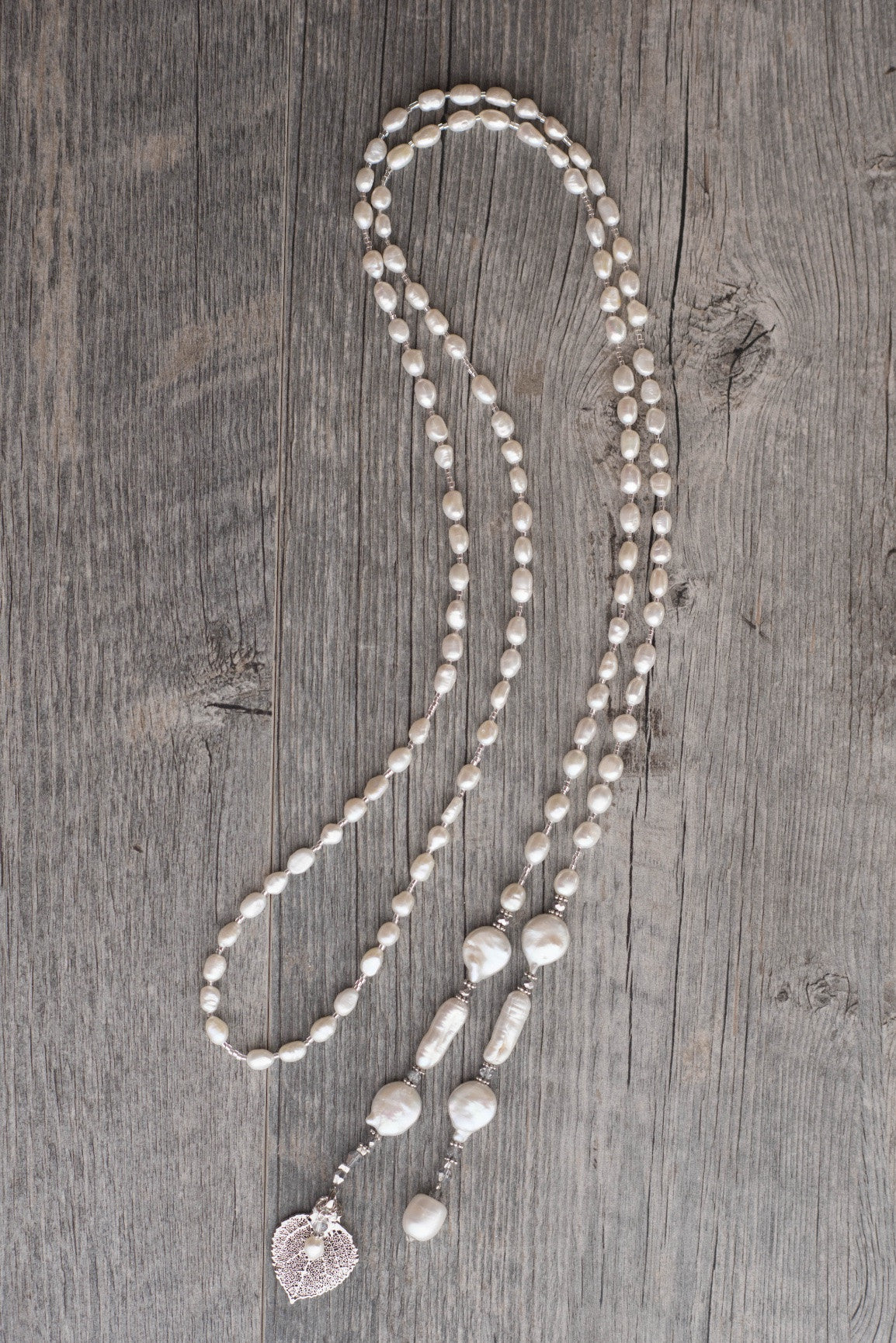 Lariat: White Freshwater & coin pearls created  with silver crystals and a silver  Aspen leaf