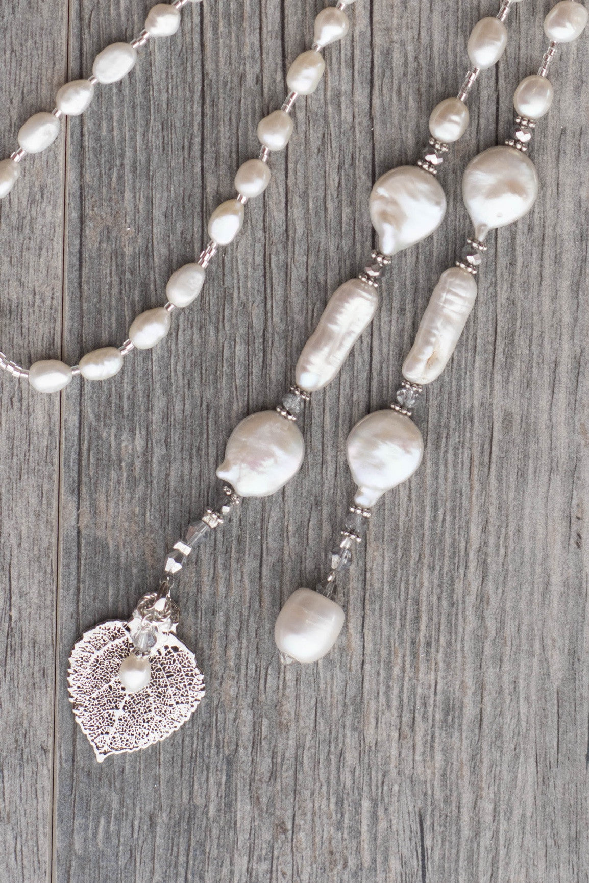 Lariat: White Freshwater & coin pearls created  with silver crystals and a silver  Aspen leaf