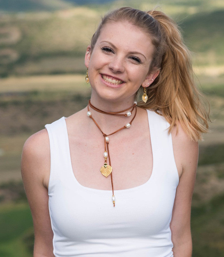 Lariat: twelve pearls highlight this versatile necklace, Bronze freshwater pearls, copper Aspen leaf, brown deerskin leather.