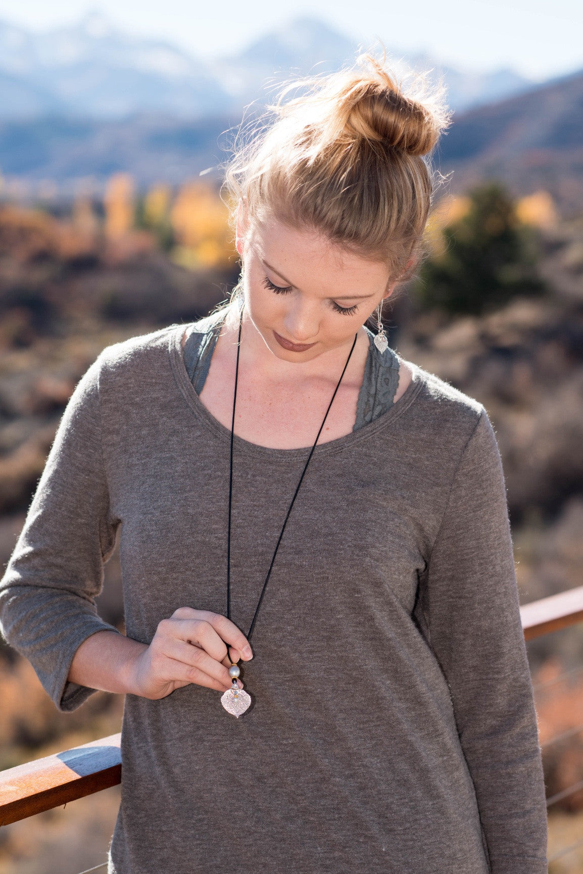 One Bronze pearl, Copper leaf,black leather  cord and bronze pearl dangle