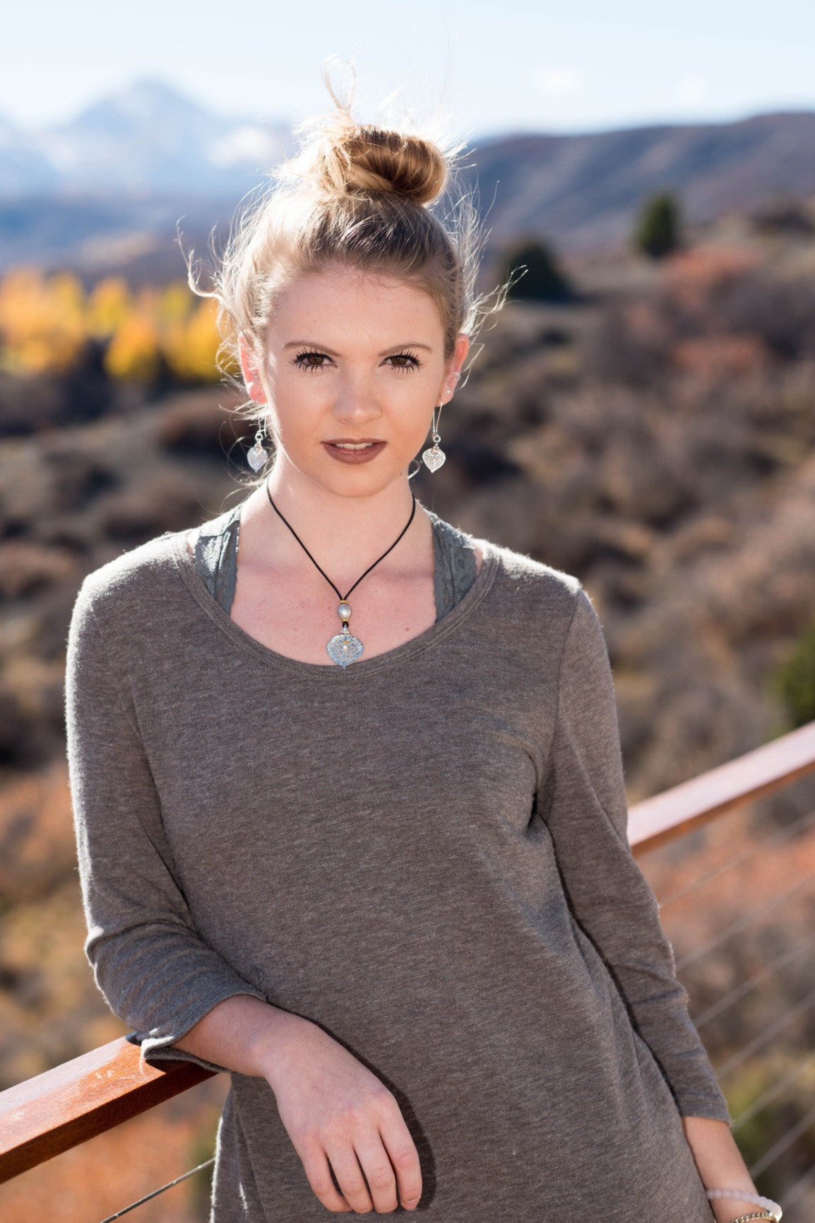 One Bronze pearl, Gold leaf,black cord, and Bronze pearl dangle