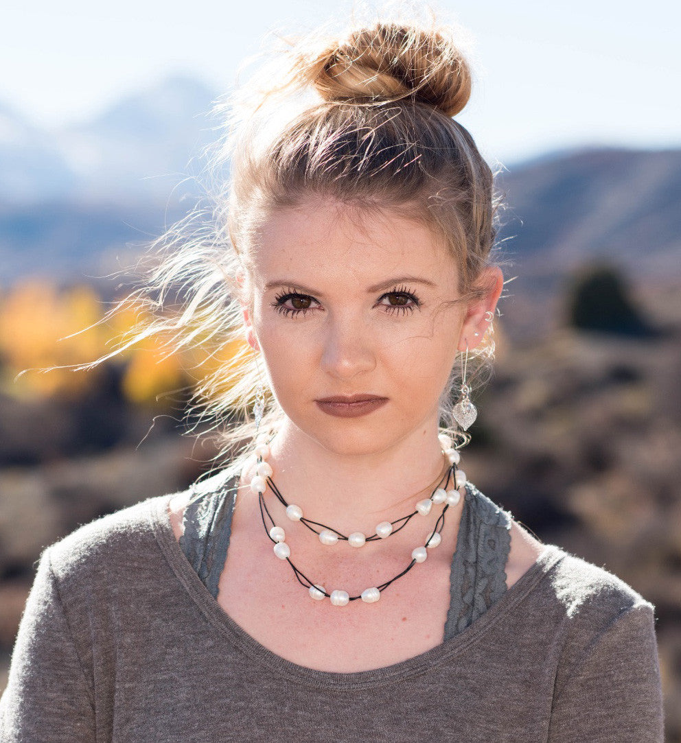 Lariat: Multi pearls accent this impressive necklace, White freshwater pearls, Gold Aspen leaf, black cord leather.