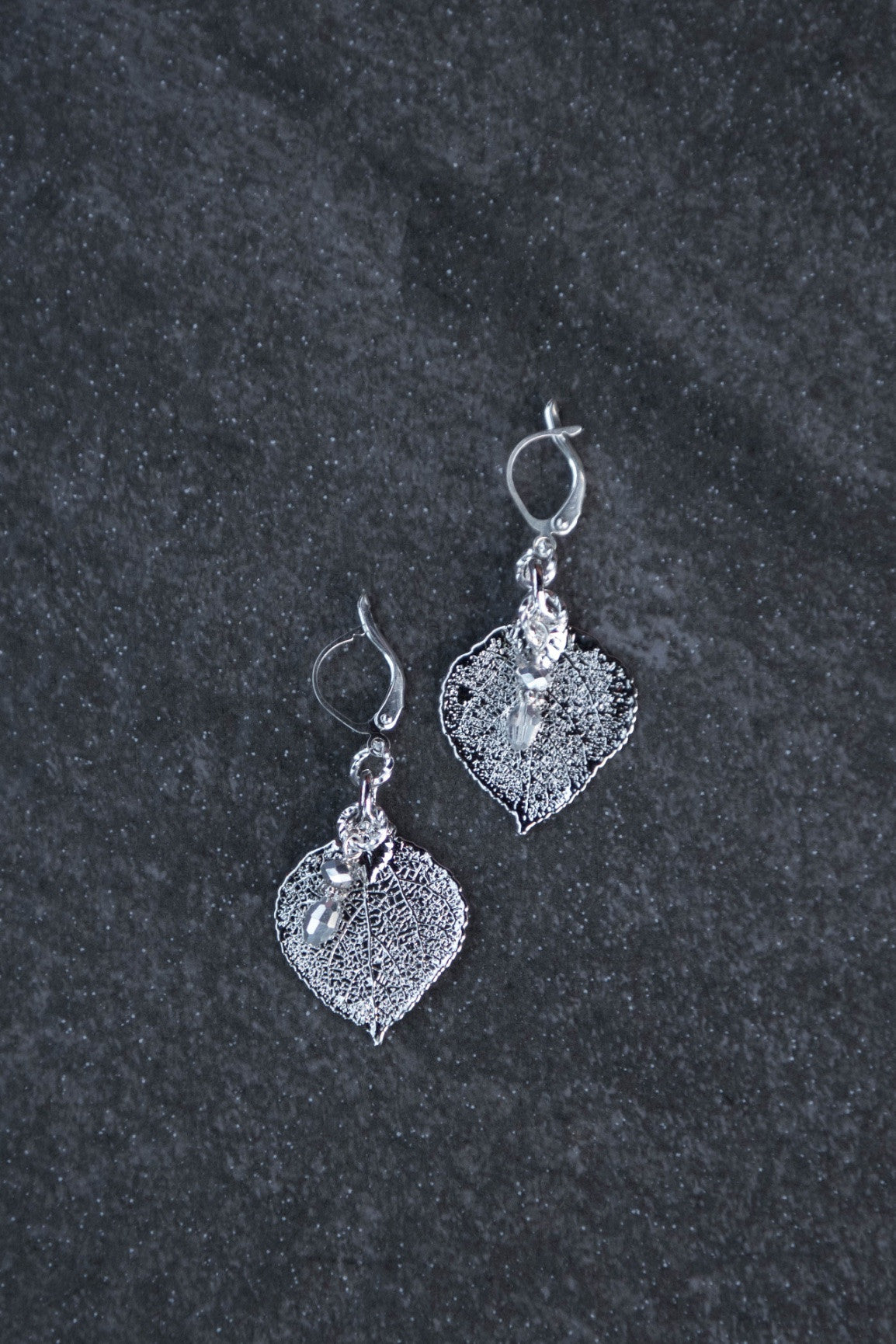 Silver earrings:  Our classic Silver leaf earrings with crystal dangles finished with hinge hardware.