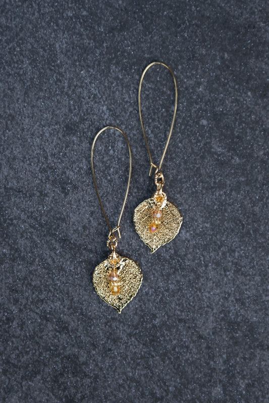 Gold earrings:  Gold leaves come together with teardrop  light weight gold long hoops. Finished with crystal dangles