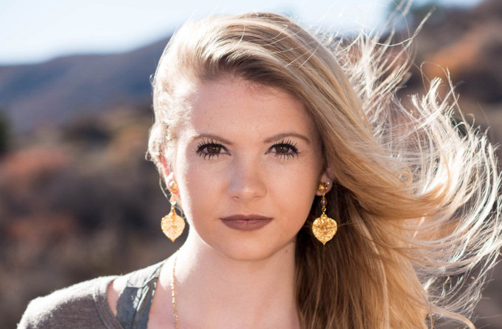 Gold earrings:  Gold  leaves with  a delicate lace post