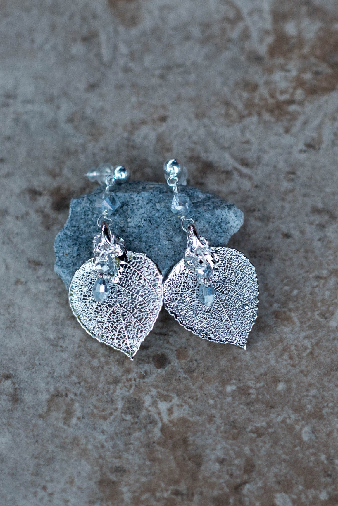 Silver earrings: Elegant Silver leaf long post earrings with crystal dangles.