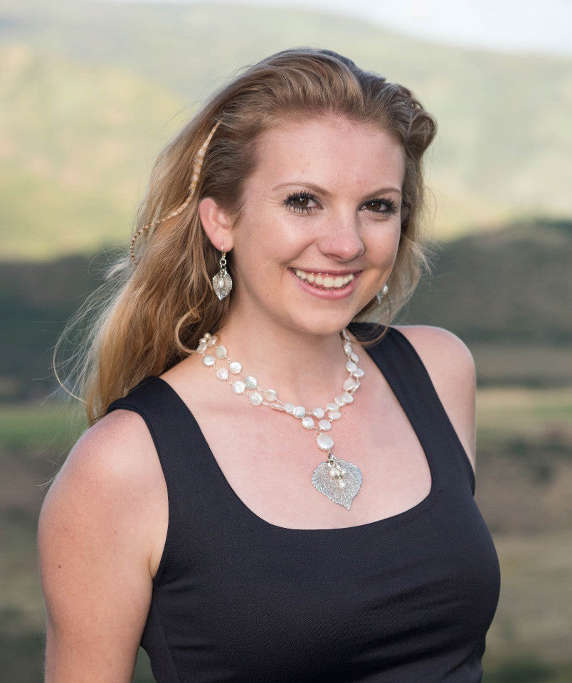 Wire twisted silver wire combine 2 strands of white freshwater coin pearls with a silver Aspen leaf & pearl dangle.